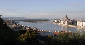 View of the Danube River with Margaret Island and the Hungarian Parliament Building.
